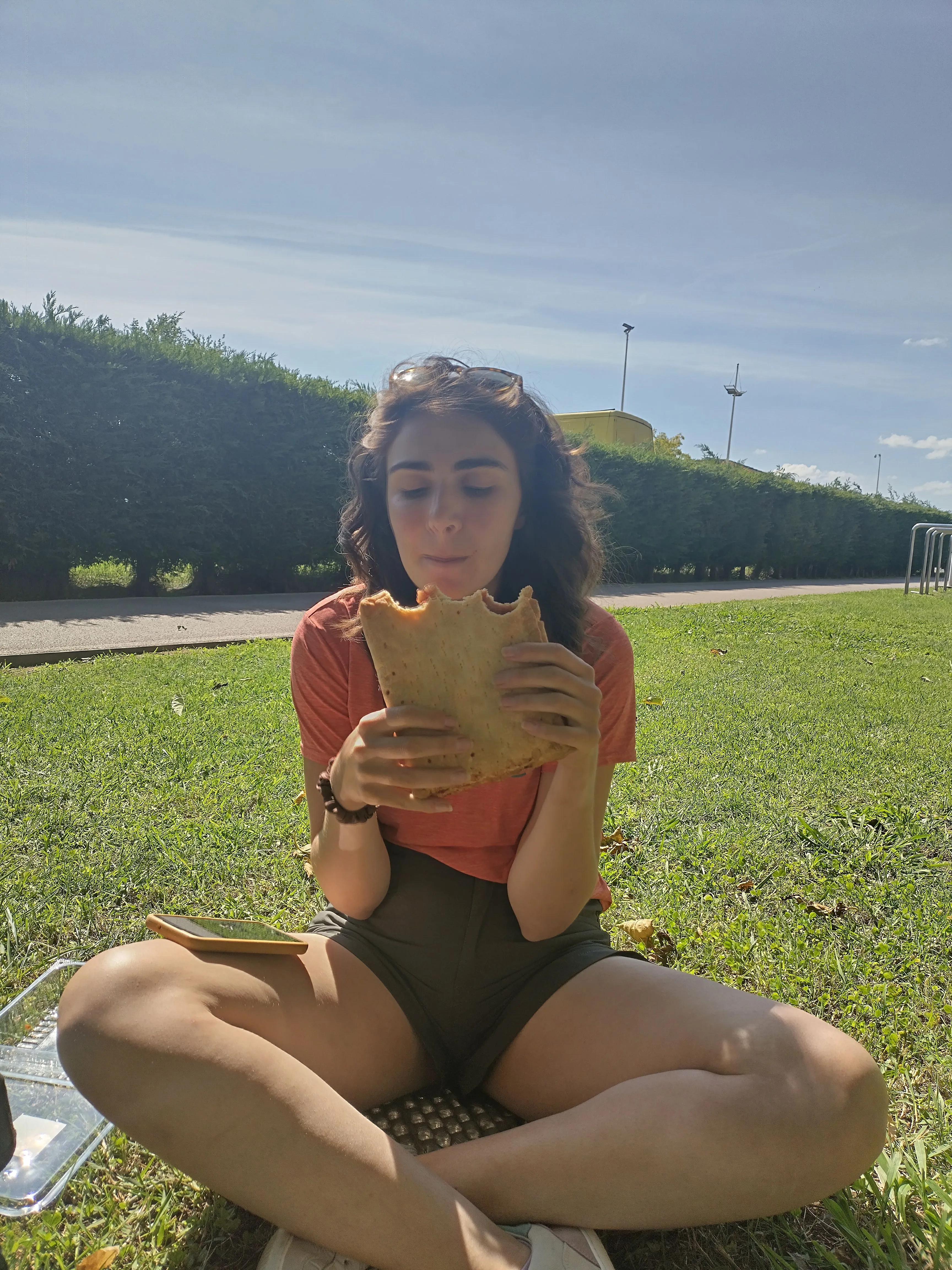 Annie eating a gluten free Empanada