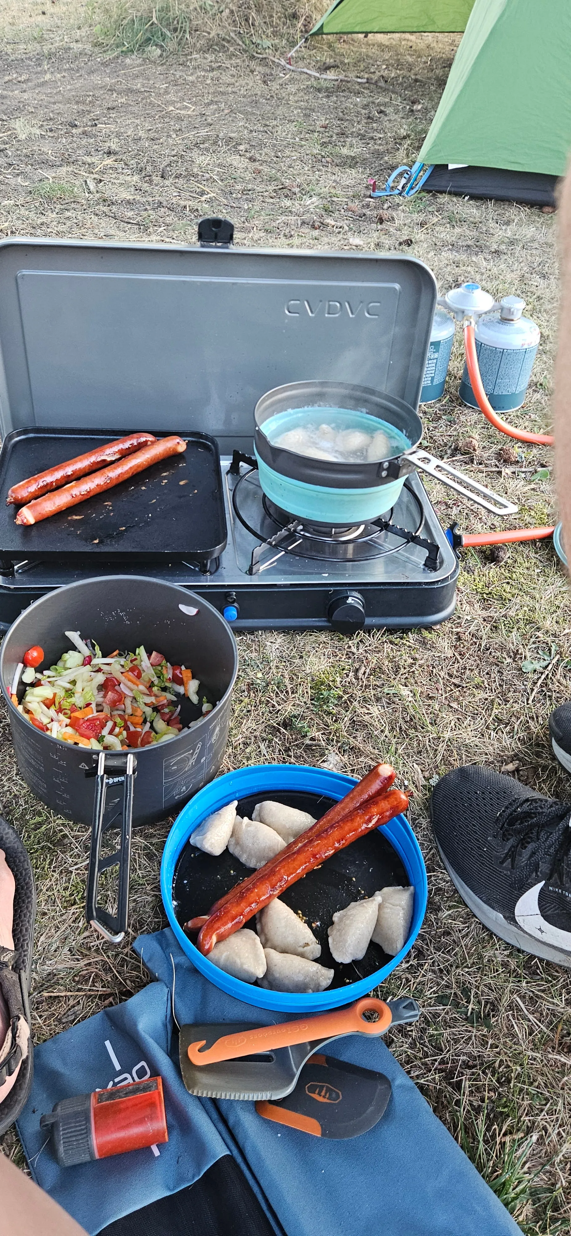 Pierogi and sausage on the camping stove